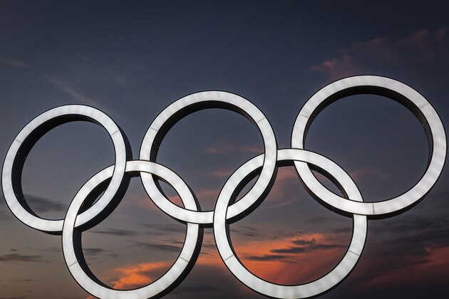 YOKOHAMA, JAPAN - JULY 22: Olympics rings are seen at sunset on July 22, 2021 in Yokohama, Japan. Olympics opening ceremony director, Kentaro Kobayashi, has been sacked on the eve of the event after footage emerged in which he appeared to make jokes about the Holocaust. Mr Kobayashi follows a number of other figures involved in the Tokyo Olympic Games who have had to step down for inappropriate remarks. (Photo by Yuichi Yamazaki/Getty Images)