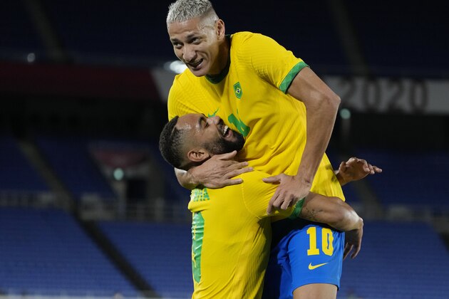 Brazil's Richarlison right celebrates scoring his side's third goal against Germany during a men's soccer match at the 2020 Summer Olympics, Thursday, July 22, 2021, in Yokohama, Japan. (AP Photo/Kiichiro Sato)