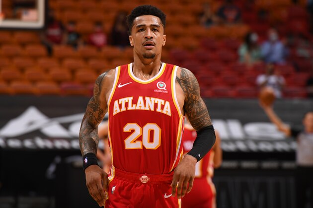 MIAMI, FL - FEBRUARY 28: John Collins #20 of the Atlanta Hawks looks on during the game against the Miami Heat on February 28, 2021 at American Airlines Arena in Miami, Florida. NOTE TO USER: User expressly acknowledges and agrees that, by downloading and or using this Photograph, user is consenting to the terms and conditions of the Getty Images License Agreement. Mandatory Copyright Notice: Copyright 2021 NBAE (Photo by Carlos Goldman/NBAE via Getty Images)