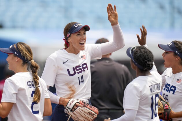 United States' Monica Abbott celebrates with teammates during the softball game between the United States and Canada at the 2020 Summer Olympics, Thursday, July 22, 2021, in Fukushima , Japan. (AP Photo/Jae C. Hong)