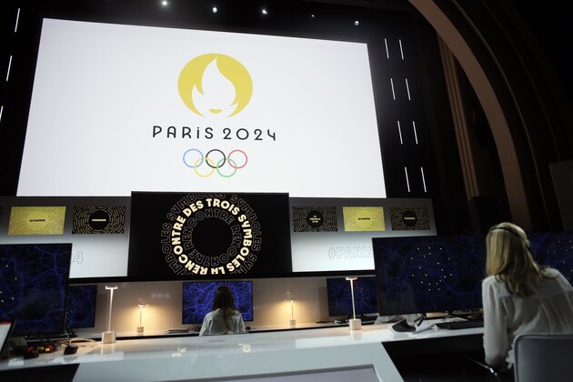 Paris 2024 Olympic logo is displayed on a screen during a ceremony, in Paris, Monday, Oct. 21, 2019. (AP Photo/Thibault Camus)
