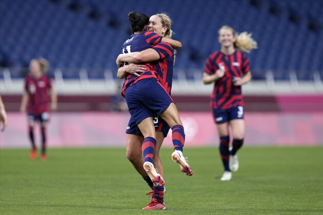 United States' Christen Press (11) celebrates with Lindsey Horan after scoring a goal during a women's soccer match at the 2020 Summer Olympics, Saturday, July 24, 2021, in Saitama, Japan. (AP Photo/Martin Mejia)