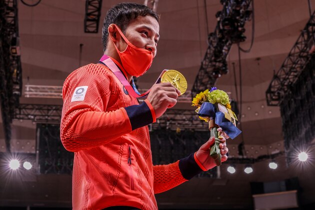 Tokyo, Japan, Friday, July 24, 2021 - Naohisa Takato  of Japan shows off the Gold Medal he won by defeating Young Wei Yang of Teipei in the Mens 60kg Judo final at Nippon Budokan at the Tokyo 2020 Olympics Opening Ceremony at Olympic Stadium.  (Robert Gauthier/Los Angeles Times via Getty Images)