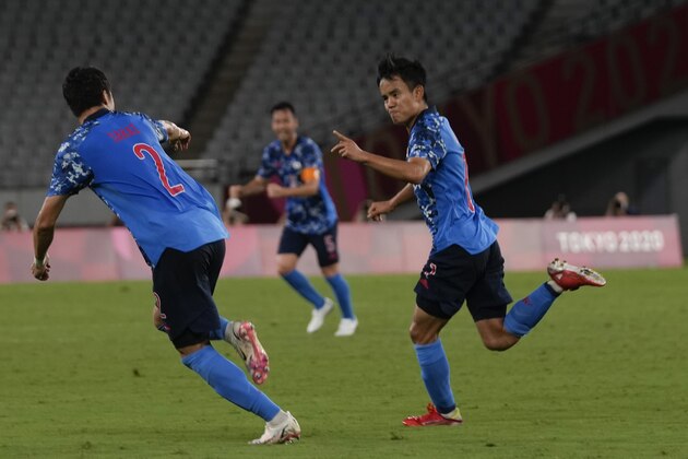 Japan's Takefusa Kubo, right, celebrates his goal with teammates during a men's soccer match against South Africa at the 2020 Summer Olympics, Thursday, July 22, 2021, in Tokyo, Japan. (AP Photo/Shuji Kajiyama)