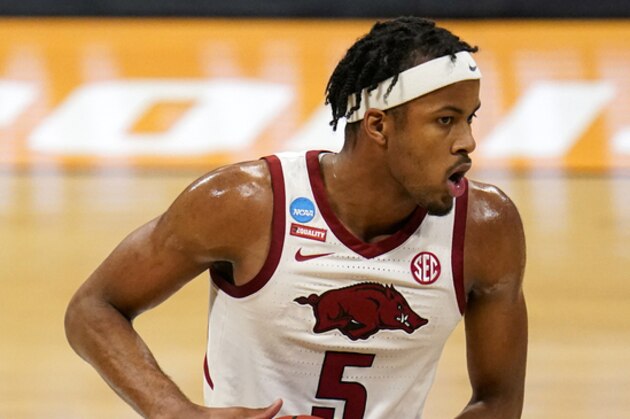 Arkansas guard Moses Moody (5) plays against Texas Tech in the first half of a second-round game in the NCAA men's college basketball tournament at Hinkle Fieldhouse in Indianapolis, Sunday, March 21, 2021. (AP Photo/Michael Conroy)