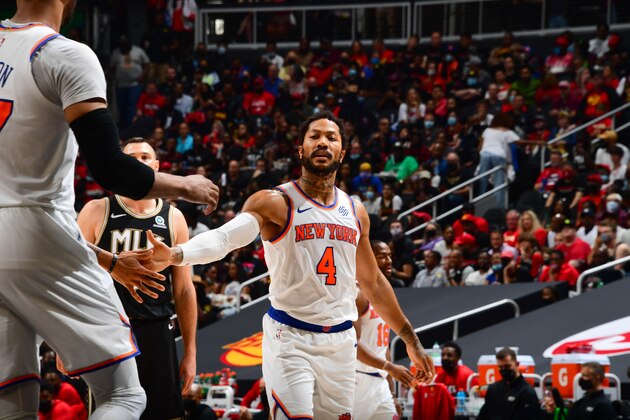 ATLANTA, GA - MAY 30: Derrick Rose #4 of the New York Knicks high fives Taj Gibson #67 of the New York Knicks during Round 1, Game 4 of the 2021 NBA Playoffs on May 30, 2021 at State Farm Arena in Atlanta, Georgia.  NOTE TO USER: User expressly acknowledges and agrees that, by downloading and/or using this Photograph, user is consenting to the terms and conditions of the Getty Images License Agreement. Mandatory Copyright Notice: Copyright 2021 NBAE (Photo by Scott Cunningham/NBAE via Getty Images)
