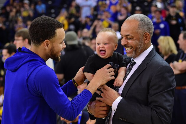 OAKLAND, CA - MARCH 31: Stephen Curry #30 of the Golden State Warriors, Canon Jack Curry and Dell Curry talk before the game against the Charlotte Hornets on March 31, 2019 at ORACLE Arena in Oakland, California. NOTE TO USER: User expressly acknowledges and agrees that, by downloading and or using this photograph, user is consenting to the terms and conditions of Getty Images License Agreement. Mandatory Copyright Notice: Copyright 2019 NBAE (Photo by Noah Graham/NBAE via Getty Images)