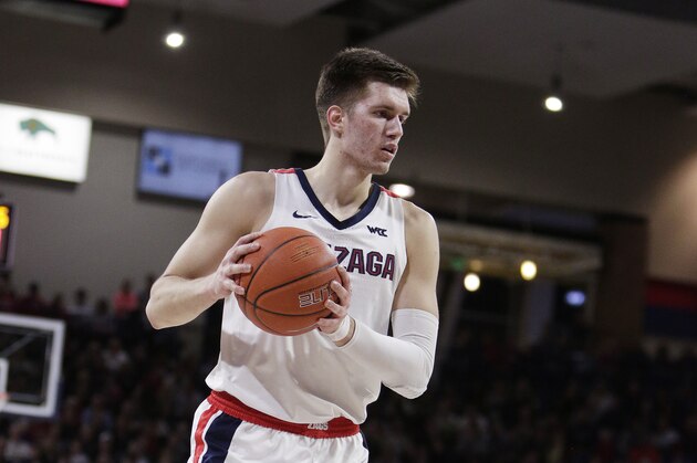 Gonzaga forward Filip Petrusev holds the ball during the first half of an NCAA college basketball game against Saint Mary's in Spokane, Wash., Saturday, Feb. 29, 2020. (AP Photo/Young Kwak)