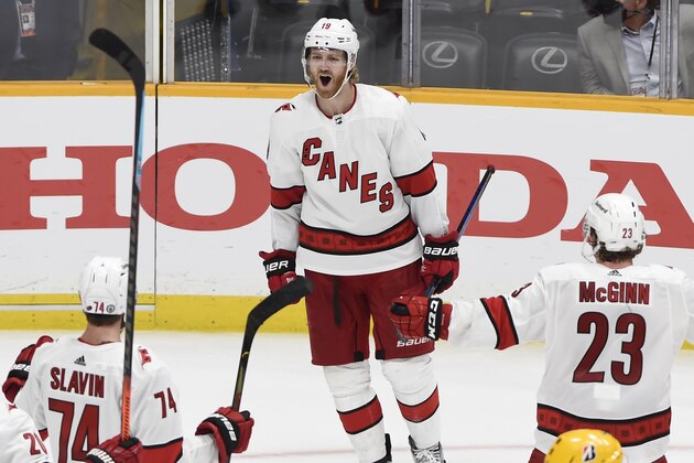 Carolina Hurricanes defenseman Dougie Hamilton (19) celebrates after scoring a goal against Nashville Predators goaltender Juuse Saros (74) during the third period in Game 6 of an NHL hockey Stanley Cup first-round playoff series Thursday, May 27, 2021, in Nashville, Tenn. (AP Photo/Mark Zaleski)