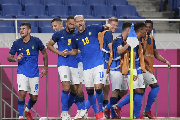 Brazil's Richarlison, center, celebrates with his teammates after scored his side's 2nd goal against Saudi Arabia during a men's soccer match at the 2020 Summer Olympics, Wednesday, July 28, 2021, in Saitama, Japan. (AP Photo/Martin Mejia)