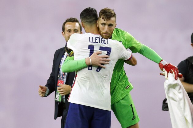 United States midfielder Sebastian Lletget (17) and goalkeeper Matt Turner (1) celebrate after their team's 1-0 win against Jamaica in a CONCACAF Gold Cup quarterfinals soccer match, Sunday, July 25, 2021, in Arlington, Texas. (AP Photo/Brandon Wade)