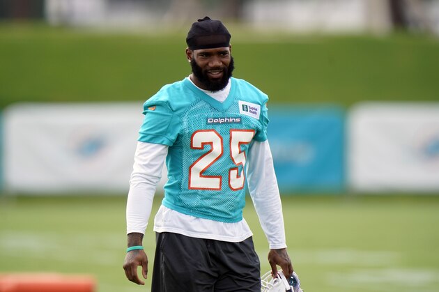 Miami Dolphins cornerback Xavien Howard prepares to warm up during NFL football practice, Wednesday, July 28, 2021, in Miami Gardens, Fla. (AP Photo/Wilfredo Lee)