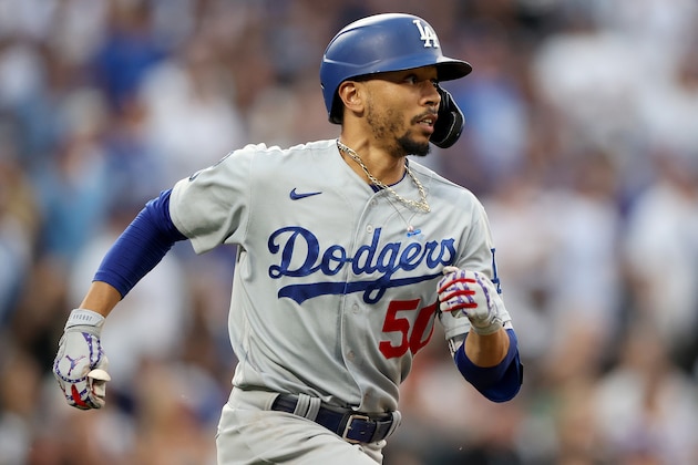 DENVER, COLORADO - JULY 17: Mookie Betts #50 of the Los Angeles Dodgers runs after hitting a double against the Colorado Rockies in the seventh inning at Coors Field on July 17, 2021 in Denver, Colorado. (Photo by Matthew Stockman/Getty Images)