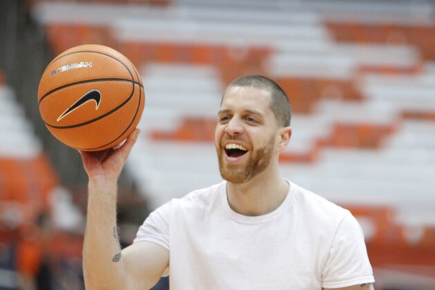 Syracuse's assistant strength coach Eric Devendorf shoots before an NCAA college basketball game against Clemson in Syracuse, N.Y., Saturday, March 3, 2018. (AP Photo/Nick Lisi)