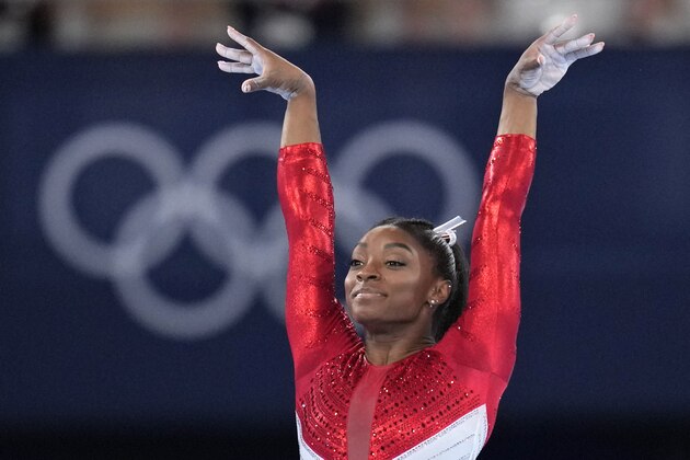 Simone Biles, of the United States, performs on the vault during the artistic gymnastics women's final at the 2020 Summer Olympics, Tuesday, July 27, 2021, in Tokyo. (AP Photo/Gregory Bull)