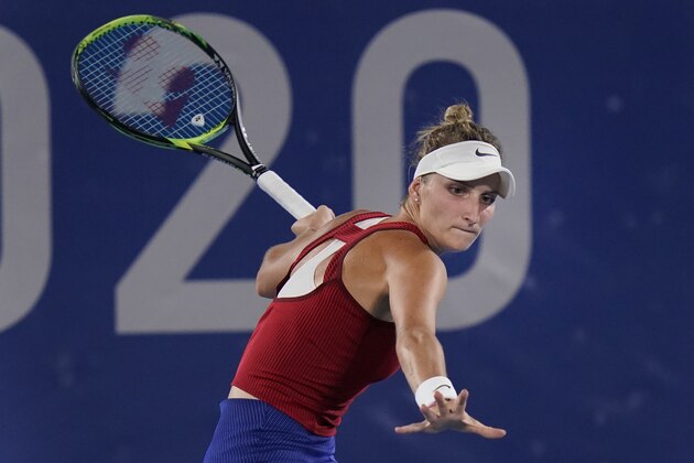 Marketa Vondrousova, of the Czech Republic, plays Elina Svitolina, of the Ukraine, during the semifinals of the tennis competition at the 2020 Summer Olympics, Thursday, July 29, 2021, in Tokyo, Japan. (AP Photo/Seth Wenig)
