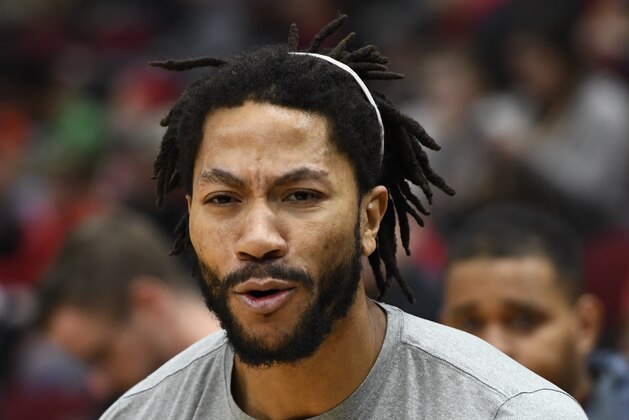 Minnesota Timberwolves guard Derrick Rose (25) warms up before an NBA basketball game against the Chicago Bulls Wednesday, Dec. 26, 2018, in Chicago. (AP Photo/Matt Marton)
