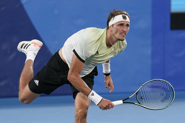 Alexander Zverev, of Germany, serves to Novak Djokovic, of Serbia, during the semifinal round of the men's tennis competition at the 2020 Summer Olympics, Friday, July 30, 2021, in Tokyo, Japan. (AP Photo/Patrick Semansky)