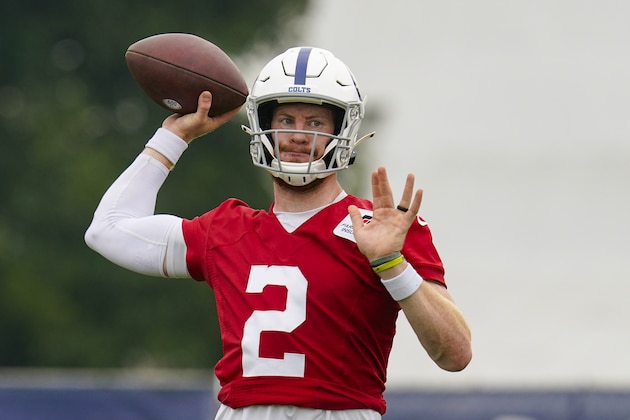 Indianapolis Colts quarterback Carson Wentz runs a drill during practice at the NFL team's football training camp in Westfield, Ind., Wednesday, July 28, 2021. (AP Photo/Michael Conroy)