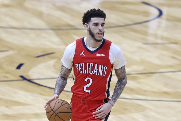 New Orleans Pelicans guard Lonzo Ball (2) dribbles the ball down court in the first half of an NBA basketball game against the San Antonio Spurs in New Orleans, Saturday, April 24, 2021. (AP Photo/Rusty Costanza)