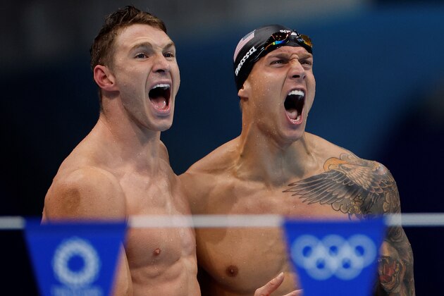 USA's Ryan Murphy (L) and USA's Caeleb Dressel celebrate winning the final of the men's 4x100m medley relay swimming event during the Tokyo 2020 Olympic Games at the Tokyo Aquatics Centre in Tokyo on August 1, 2021. (Photo by Odd ANDERSEN / AFP) (Photo by ODD ANDERSEN/AFP via Getty Images)
