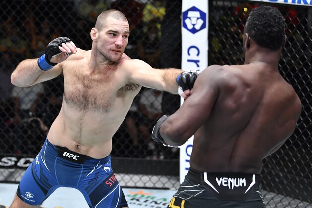 LAS VEGAS, NEVADA - JULY 31: (L-R) Sean Strickland punches Uriah Hall of Jamaica in a middleweight fight during the UFC Fight Night event at UFC APEX on July 31, 2021 in Las Vegas, Nevada. (Photo by Chris Unger/Zuffa LLC) LAS VEGAS, NEVADA - JULY 31: (L-R) Sean Strickland punches Uriah Hall of Jamaica in a middleweight fight during the UFC Fight Night event at UFC APEX on July 31, 2021 in Las Vegas, Nevada. (Photo by Chris Unger/Zuffa LLC)