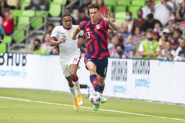 AUSTIN, TX - JULY 29: United States forward Matthew Hoppe (13) attack the ball upfield ahead of Qatar defender Pedro Miguel (2) during the Gold Cup semifinal match between the United States and Qatar on Thursday July 29th, 2021 at Q2 stadium in Austin,TX.  (Photo by Nick Tre. Smith/Icon Sportswire via Getty Images)