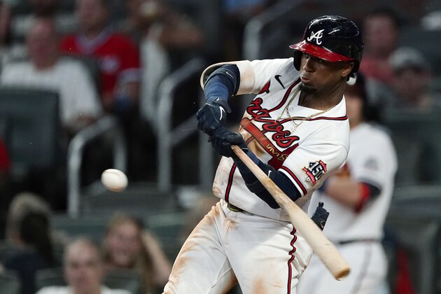 Atlanta Braves' Ozzie Albies hits a single during the third inning of the team's baseball game against the New York Mets on Wednesday, June 30, 2021, in Atlanta. (AP Photo/John Bazemore)