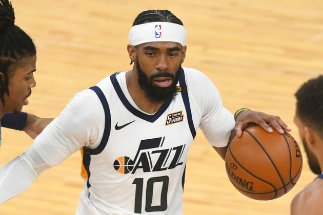 Utah Jazz guard Mike Conley is pressured by the Memphis Grizzlies during the second half of Game 3 of an NBA basketball first-round playoff series Saturday, May 29, 2021, in Memphis, Tenn. (AP Photo/John Amis)