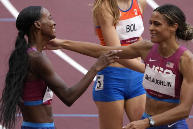 Sydney McLaughlin, of United States after winning the gold medal in the final of the the women's 400-meter hurdles ahead of Dalilah Muhammad, of United States, silver, and Femke Bol, of Netherlands, bronze, at the 2020 Summer Olympics, Wednesday, Aug. 4, 2021, in Tokyo, Japan. (AP Photo/Charlie Riedel)