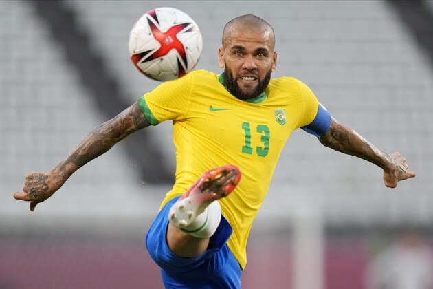 Brazil's Dani Alves kicks the ball during a men's soccer semifinal match against Mexico at the 2020 Summer Olympics, Tuesday, Aug. 3, 2021, in Kashima, Japan. (AP Photo/Andre Penner) Brazil's Dani Alves kicks the ball during a men's soccer semifinal match against Mexico at the 2020 Summer Olympics, Tuesday, Aug. 3, 2021, in Kashima, Japan. (AP Photo/Andre Penner)