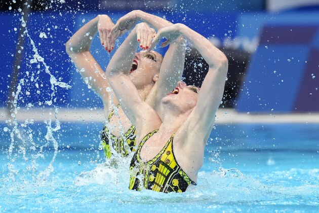 Svetlana Kolesnichenko and Svetlana Romashina of Russian Olympic Committee compete in the duet technical routine at the the 2020 Summer Olympics, Tuesday, Aug. 3, 2021, in Tokyo, Japan. (AP Photo/Alessandra Tarantino)