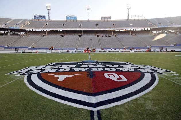 FILE - In this Oct. 10, 2020, file photo, The Red River Showdown logo is displayed on the field of the Cotton Bowl, prior to an NCAA college football game between the University of Texas and Oklahoma, in Dallas. Texas and Oklahoma made a request Tuesday, July 27, 2021, to join the Southeastern Conference — in 2025 —- with SEC Commissioner Greg Sankey saying the league would consider it in the “near future.” (AP Photo/Michael Ainsworth, File)