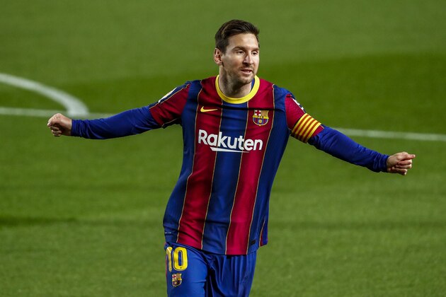 Barcelona's Lionel Messi celebrates after scoring the opening goal during the Spanish La Liga soccer match between FC Barcelona and Getafe at the Camp Nou stadium in Barcelona, Spain, Thursday, April 22, 2021. (AP Photo/Joan Monfort)
