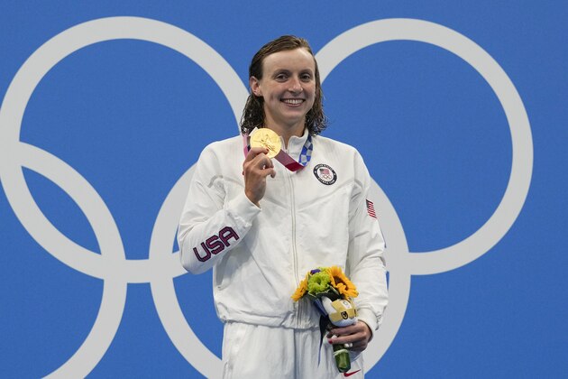Kathleen Ledecky, of United States, poses after winning the gold medal in the women's 800-meter freestyle final at the 2020 Summer Olympics, Saturday, July 31, 2021, in Tokyo, Japan. (AP Photo/Gregory Bull)