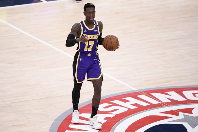 Los Angeles Lakers guard Dennis Schroder (17) dribbles the ball during the second half of an NBA basketball game against the Washington Wizards, Wednesday, April 28, 2021, in Washington. (AP Photo/Nick Wass)