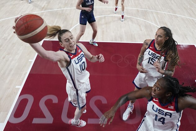 United States' Breanna Stewart (10), with Brittney Griner (15) and Tina Charles (14) grabs a refund during a women's semifinal basketball game against Serbia at the 2020 Summer Olympics, Friday, Aug. 6, 2021, in Saitama, Japan. (AP Photo/Eric Gay)
