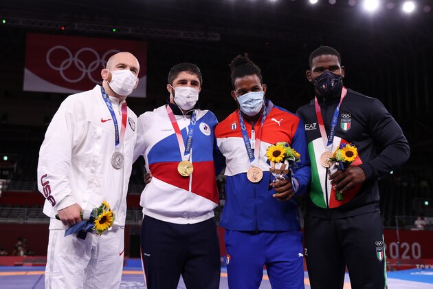 TOKYO, JAPAN - AUGUST 07: (L-R) Silver medalist Kyle Frederick Snyder of Team United States, gold medalist Abdulrashid Sadulaev of Russian Olympic Committee and bronze medalists Reineris Salas Perez of Team Cuba and Abraham De Jesus Conyedo Ruano of Team Italy pose during the medal ceremony for the Men's Freestyle 97kg on day fifteen of the Tokyo 2020 Olympic Games at Makuhari Messe Hall on August 07, 2021 in Tokyo, Japan. (Photo by Naomi Baker/Getty Images)