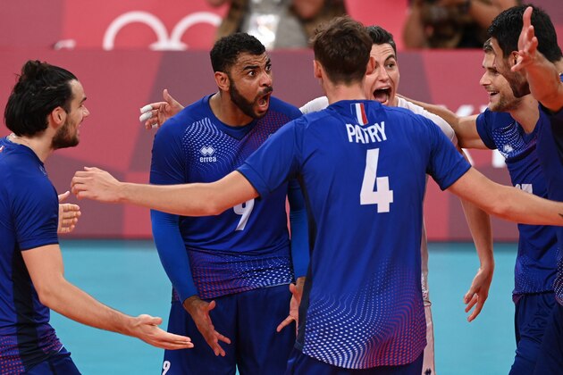 France's Earvin Ngapeth (C) celebrates a point with teammates in the men's gold medal volleyball match between France and Russia during the Tokyo 2020 Olympic Games at Ariake Arena in Tokyo on August 7, 2021. (Photo by JUNG Yeon-je / AFP) (Photo by JUNG YEON-JE/AFP via Getty Images)