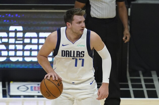 Dallas Mavericks guard Luka Doncic (77) controls the ball during Game 7 of an NBA basketball first-round playoff series against the Los Angeles Clippers Sunday, June 6, 2021, in Los Angeles, Calif. (AP Photo/Ashley Landis)