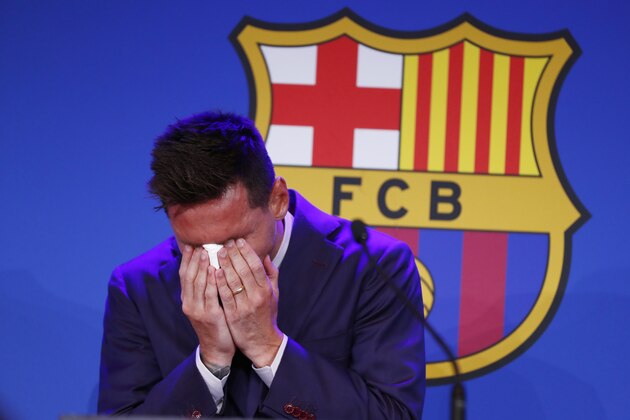 Lionel Messi cries at the start of a press conference at the Camp Nou stadium in Barcelona, Spain, Sunday, Aug. 8, 2021. FC Barcelona had previously announced the negotiations with Lionel Messi had ended and that Messi would be leaving the club. (AP Photo/Joan Monfort)