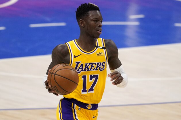 Los Angeles Lakers' Dennis Schroder handles the ball during an NBA basketball game against the Dallas Mavericks in Dallas, Thursday, April 22, 2021. (AP Photo/Tony Gutierrez)
