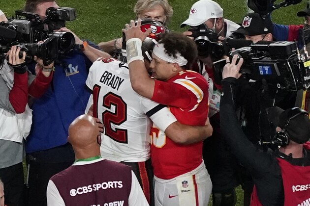 Tampa Bay Buccaneers' Tom Brady (12) and Kansas City Chiefs' Patrick Mahomes (15) greet following the NFL Super Bowl 55 football game Sunday, Feb. 7, 2021, in Tampa, Fla. The Buccaneers defeated the Chiefs 31-9 to win the Super Bowl. (AP Photo/Chris Carlson)