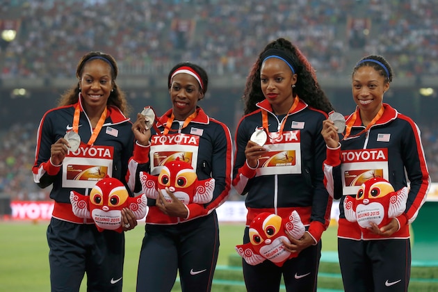 Sanya Richards-Ross, Francena Mccorory Natasha Hastings and Allyson Felix, from left,  of the United States pose with their silver medals during the ceremony for the women's 4x400m relay at the World Athletics Championships at the Bird's Nest stadium in Beijing, Sunday, Aug. 30, 2015. (AP Photo/Ng Han Guan)