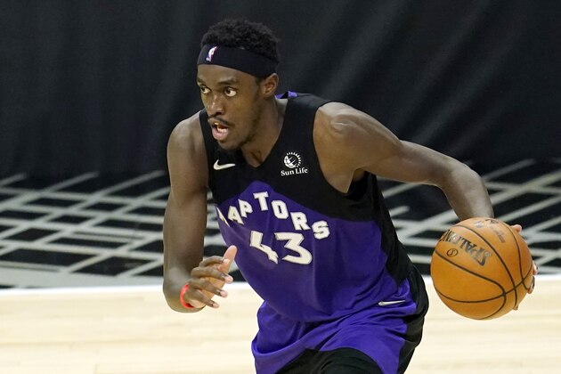 FILE - In this May 4, 2021, file photo, Toronto Raptors forward Pascal Siakam dribbles during an NBA basketball game against the Los Angeles Clippers in Los Angeles. The shoulder injury that ended Siakam's season early will likely force him to miss the start of next season as well. The Raptors said Friday, June 11, 2021, that Siakam had surgery last week to repair a torn labrum in his left shoulder, with an anticipated recovery and rehabilitation time of five months.  (AP Photo/Marcio Jose Sanchez, File)