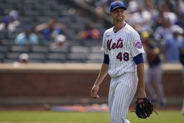 New York Mets starting pitcher Jacob deGrom (48) reacts as he leaves the field after the fifth inning of the first baseball game of a doubleheader against the Milwaukee Brewers, Wednesday, July 7, 2021, in New York. (AP Photo/Frank Franklin II)