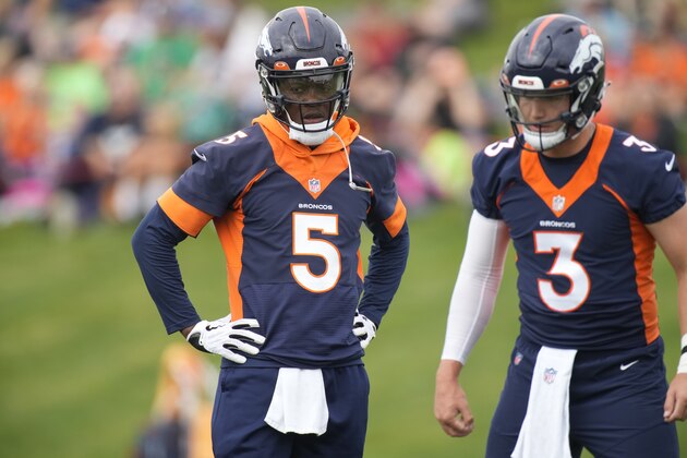 Denver Broncos quarterback Teddy Bridgewater (5) and Denver Broncos quarterback Drew Lock (3) taking part in drills at an NFL football training camp at team headquarters Saturday, July 31, 2021, in Englewood, Colo. (AP Photo/David Zalubowski)