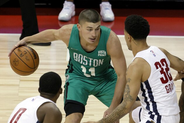 LAS VEGAS, NEVADA - AUGUST 10:  Payton Pritchard #11 of the Boston Celtics is guarded by Semaj Christon #0 and Josh Gray #32 of the Denver Nuggets during the 2021 NBA Summer League at the Thomas & Mack Center on August 10, 2021 in Las Vegas, Nevada. The Celtics defeated the Nuggets 107-82. NOTE TO USER: User expressly acknowledges and agrees that, by downloading and or using this photograph, User is consenting to the terms and conditions of the Getty Images License Agreement. (Photo by Ethan Miller/Getty Images)