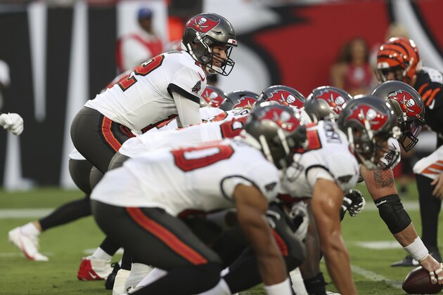 Tampa Bay Buccaneers quarterback Tom Brady (12) lines up against the Cincinnati Bengals during the first half of an NFL preseason football game Saturday, Aug. 14, 2021, in Tampa, Fla. (AP Photo/Mark LoMoglio)