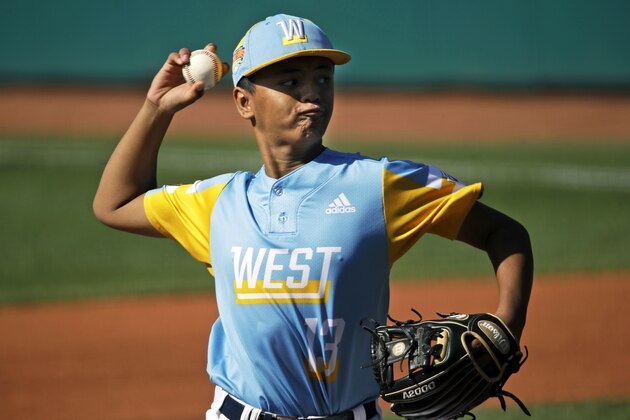 Wailuku, Hawaii's Shiloh Gilliland (13) delivers a pitch against Japan in the first inning of the Consolation baseball game at the Little League World Series tournament in South Williamsport, Pa., Sunday, Aug. 25, 2019. Japan won the game 5-0. (AP Photo/Tom E. Puskar)